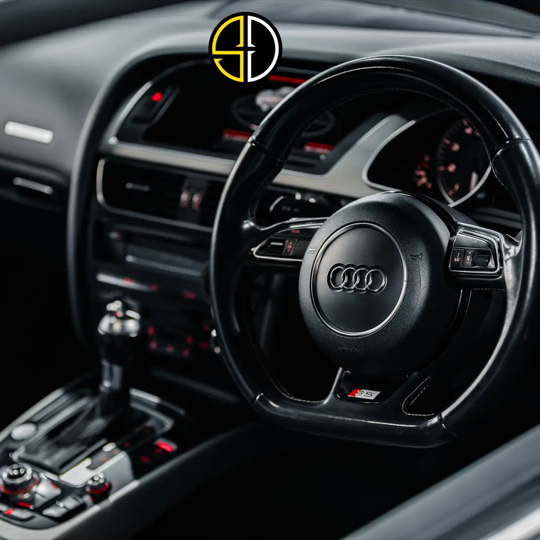Freshly detailed Audi interior with steering wheel and centre console